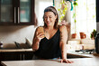 © Malambo/peopleimages.com - Happy, woman and phone in kitchen with smile on social media for online recipe for lunch on app. Home, technology and internet search for meal inspiration with video, message or website at counter