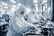 © Bussakon - Technicians in Sterile Suits Assembling Delicate Components in a High Tech Clean Room