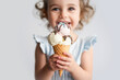 © Tascha - Young cute child, around 3-4 years old, short brown hair, eating ice cream, white background - A child with short brown hair, about 3-4 years old, eating ice cream, set against a white background