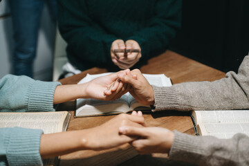 Christians are congregants join hands to pray and seek the blessings of God.