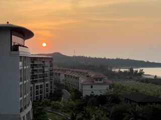 Sunset over coastal resort buildings