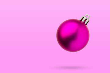 Wall Mural - Pink Christmas ball isolated on pink background