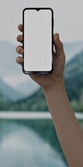 Black African-American middle aged male using smartphone with a blank white screen. Nature, lake, mountains apps mockup. Vertical phone orientation