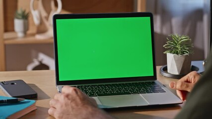 Wall Mural - Guy using touchpad chromakey laptop at desk closeup. Businessman surfing online