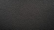 © Fahmi - Black leather texture background. Close up shot of a grainy leather surface for your design projects