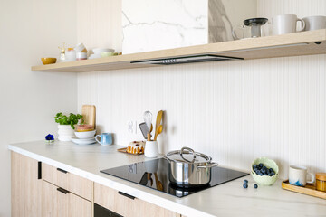 Wall Mural - Modern kitchen countertop with stove and pot on top