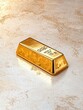 © TingeGlint - A shiny gold bar rests on a textured surface, symbolizing wealth, prosperity, and luxury.