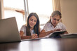© peopleimages.com - Kids, writing and tablet for education at house with online learning, study website and research for homework. Girls, family and technology for notebook of reading assessment, information and support