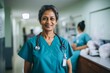 © CojanAI - Smiling portrait of a middle aged Indian nurse in hospital