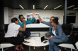 © JonoErasmus - Successful african Business Meeting with Team High-Fiving in Office