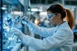 © Milos - A focused engineer wearing safety goggles and gloves works meticulously with robotic components in a high-tech laboratory, illustrating precision in technology development.