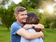 © peopleimages.com - Outdoor, hug and man with smile, couple and happy for date in park, nature and love in relationship. Portrait, embrace and affection in marriage, people and care for partner, dating and relax in USA