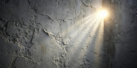Aufkleber - A single shaft of light penetrates the darkness, illuminating the textured surface of a weathered concrete wall.