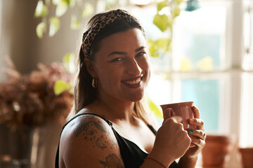 Home, portrait and woman with coffee for drink, warm beverage and happiness in kitchen by window. House, female person and smile with tea cup for relax, espresso or cappuccino for wellness in morning