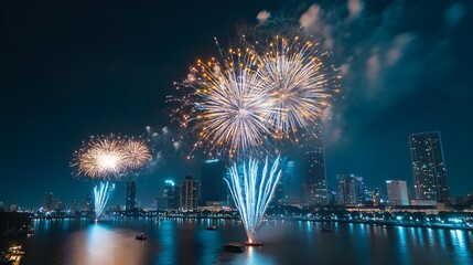 Dazzling Fireworks Display Over Illuminated City Skyline at Night