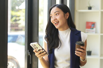 Asian woman succeeds at office