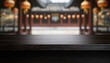 © Rangga Bimantara - A blurred background of a traditional structure with hanging lanterns, featuring a wooden table in the foreground.