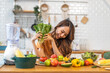 © Art_Photo - Portrait of beauty body slim healthy asian woman eating vegan food healthy with fresh vegetable salad in kitchen at home.diet, vegetarian, fruit, wellness, health, green food.Fitness and healthy food