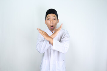 shocked asian man muslim crossed his arm isolated on white background