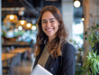 © Santy Hong - A casual business portrait taken in a coworking space, with the subject smiling and holding a laptop, conveying a relaxed professionalism