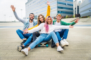 multiethnic group of young students bonding outdoors - happy teen students meeting outside school an