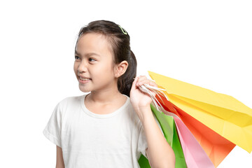 A young girl is holding a bunch of colorful shopping bags