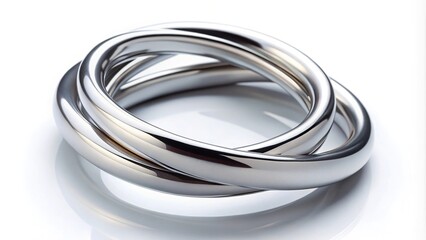 Wall Mural - Macro close-up of interlocking silver rings on white background isolated