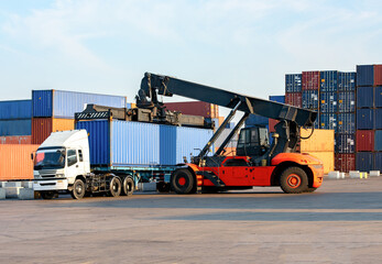 Wall Mural - Reachstacker  handling loading Containers At Industrial Port And Container Yard To Truck