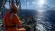 © Nataliya - A photorealistic image of a worker on an offshore drilling platform, fully dressed in protective gear and a hard hat, operating heavy machinery in the middle of the ocean. The vast