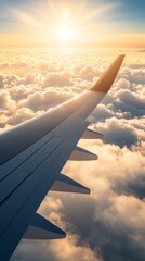 Poster - Airplane soars above a stunning sunset, casting a shadow on fluffy clouds. The warm golden light creates a serene atmosphere