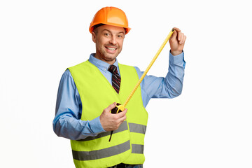 Poster - Builder Workman Posing With Tape-Measure Smiling To Camera Standing On White Background. Building House Concept. Studio Shot