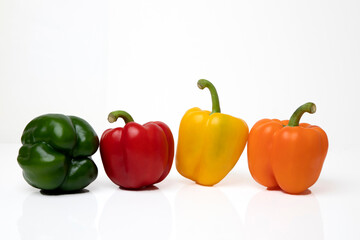 red and yellow peppers on white