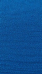 Poster - The texture of a blue carpet has small fibers that create a dense and soft surface. Ideal for backgrounds and texture projects