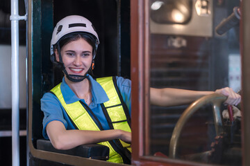 Engineer checking construction process railway and checking work on railroad station . Railway engineer checking machines in train station. Train engineer concept