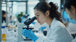 © Vika art - Asian scientist working in laboratory.