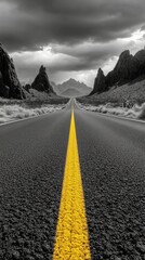 Wall Mural - A winding road cuts through rocky mountains under an overcast sky