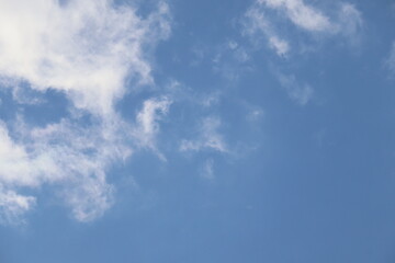 sunny sky with white clouds on a sunny late summer day