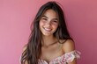 © Maelgoa - Young Latino woman with long brown hair, wearing a summer dress, looking happy on a pink background 2