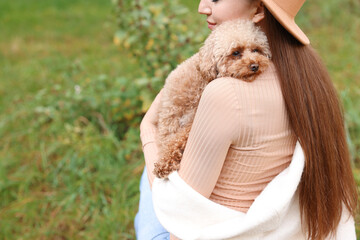 Sticker - Woman with cute dog outdoors, closeup. Space for text