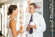 © JackF - Positive man apothecary speaking to female customer holding cream in hand in pharmacy store