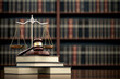 © Tondone - Scales of justice on books in a law library, symbolizing legal balance and authority in a professional office setting.