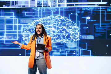 Poster - Upbeat programmer using tablet during presentation, exploring ways emerging AI technologies can enhance businesses. Jolly woman at event presents artificial intelligence using device and microphone