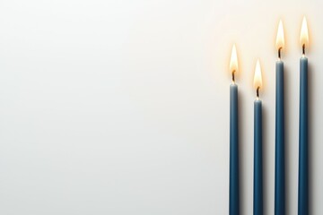 Canvas Print - A row of blue candles are lit on a white background