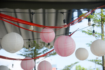 Close-up of colorful lanterns hanging to decorate shops and coffee shops in Vietnam.