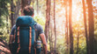 © Panassak - Backpacker Standing in Sunlit Forest