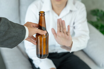 man refuses say no and avoid to drink an alcohol whiskey, stopping hand sign male, alcoholism treatment, alcohol addiction, quit booze, Stop Drinking Alcohol. Refuse Glass liquor, unhealthy, reject