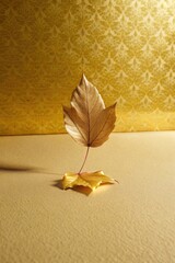 Canvas Print - A single golden leaf standing against a textured golden wall.