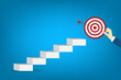 © madedee - Goal, motivation to success. Business improvement concept. Climb up stairs to reach goal target on the top.
