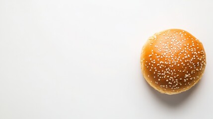 Wall Mural - Top-down photograph of a hamburger bun on a white backdrop offering room for copy or additional images