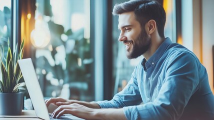 Poster - Smiling man working on laptop in bright indoor setting, natural light, plants
